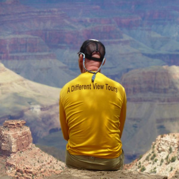 Jon Albert Sitting on Grand Canyon Rim