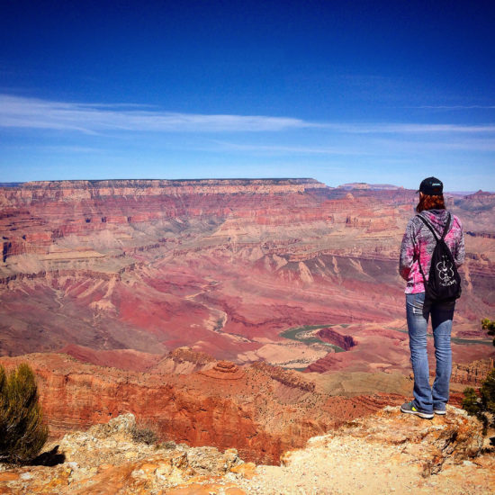Girl Standing at Lipan Point Grand Canyon ith Unkar Delta and Great Unconformity